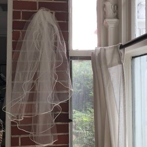 Ivory wedding veil with satin trim and comb